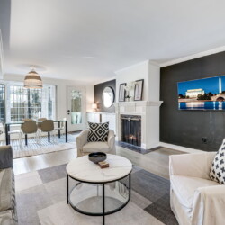 Living/Dining Room: Sleeper Sofa, 55" 4K TV, 100+ Live Channels. Living and dining room with sleeper sofa and 55" Samsung 4K TV showing 100+ live channels.